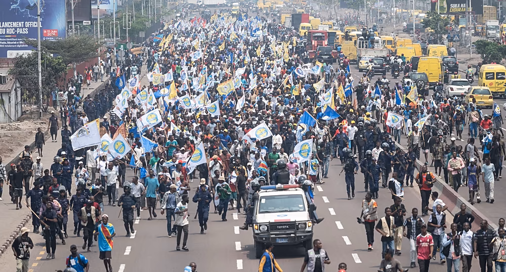 Police disperse protesters during an anti-government rally in Kinshasa