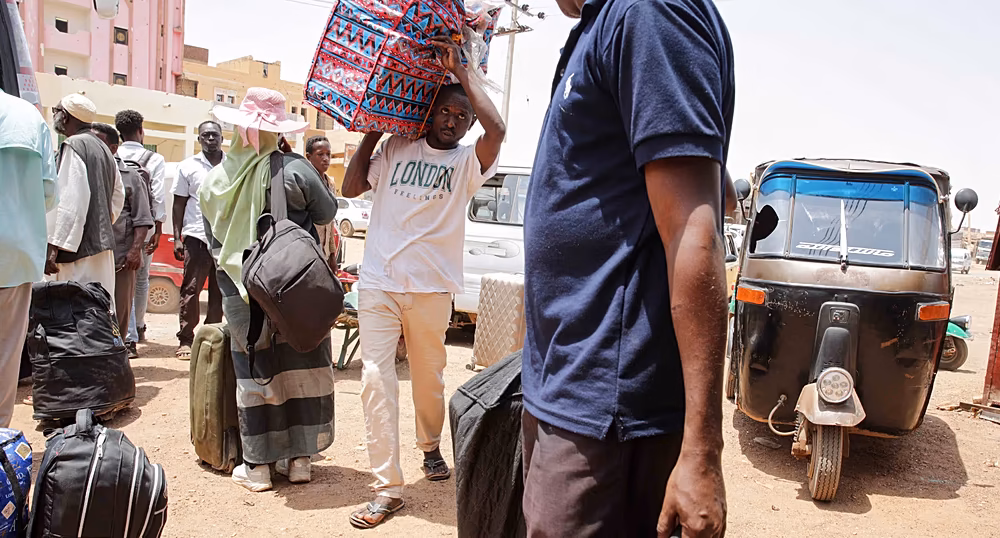 Sudanese refugees arriving at a transit centre in eastern Chad