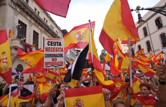 Protesters marching from Cibeles Square toward the Moncloa Arch during a demonstration over the Ceuta migration crisis